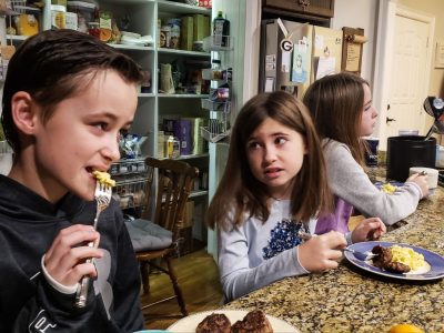 gen-z-kids-eating-breakfast-on-kitchen-counter-tog-2022-11-12-09-52-00-utc (1)